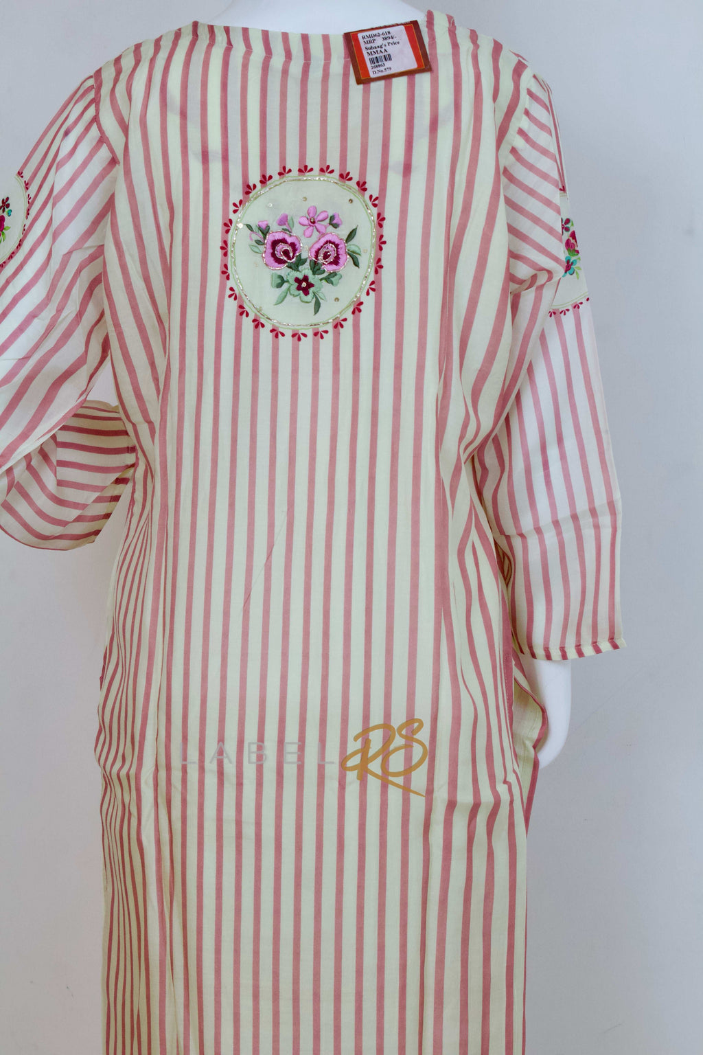 Striped Suit adorned with delicate tassels.